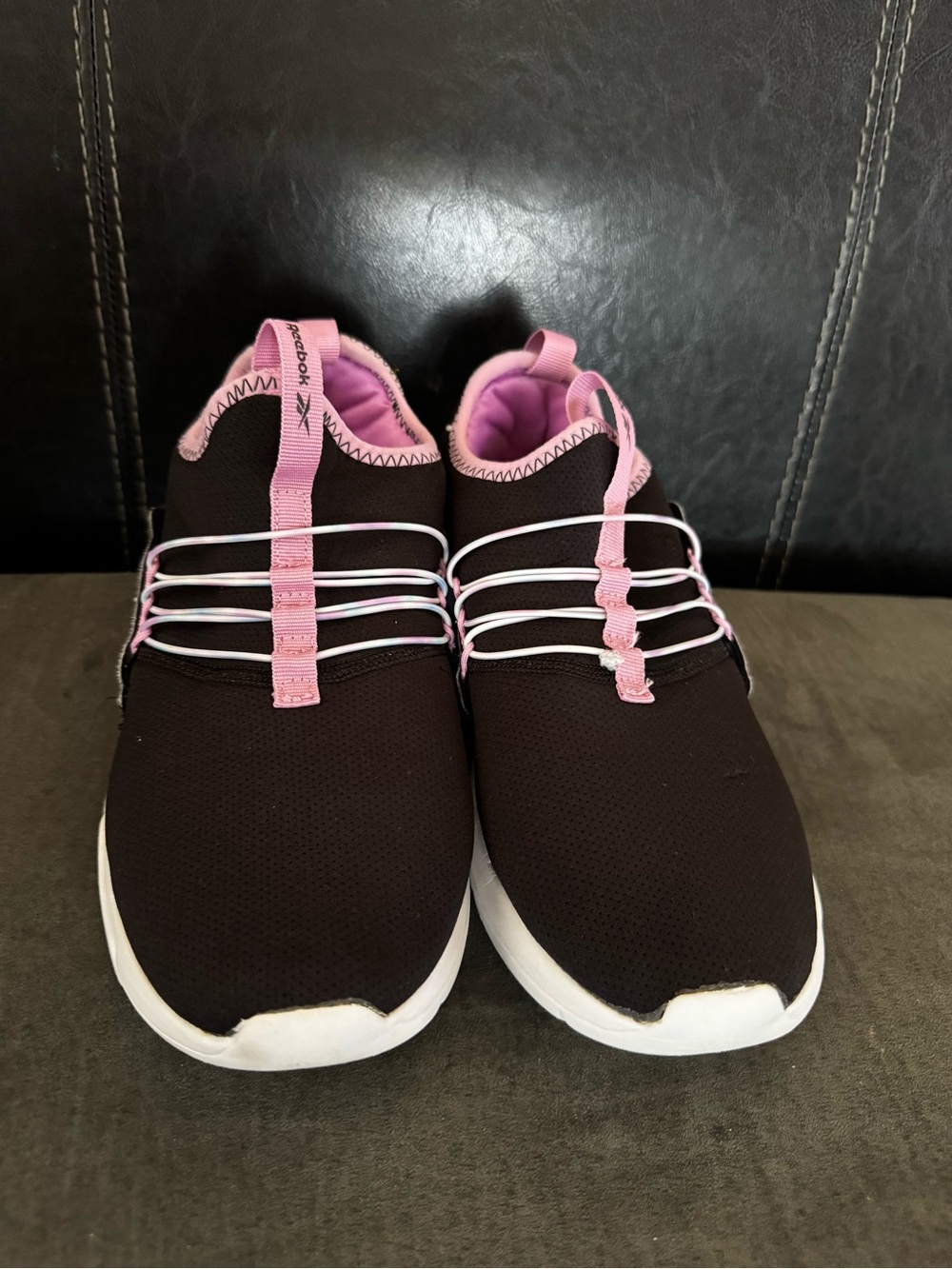 . Reebok preloved. girls Black and Pink Slip-On Sneakers.